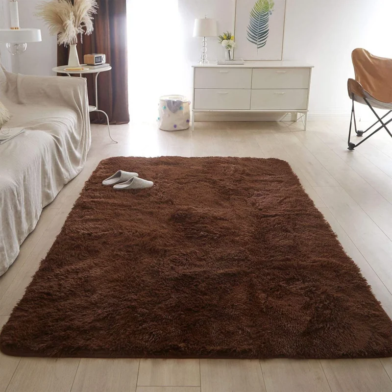 Dark brown shaggy rug in a bright living room.