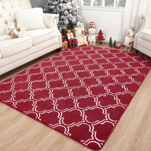 Red and white patterned rug in a living room.