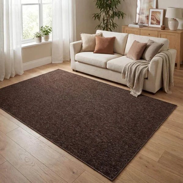 Solid dark brown low-pile rug in a living room.